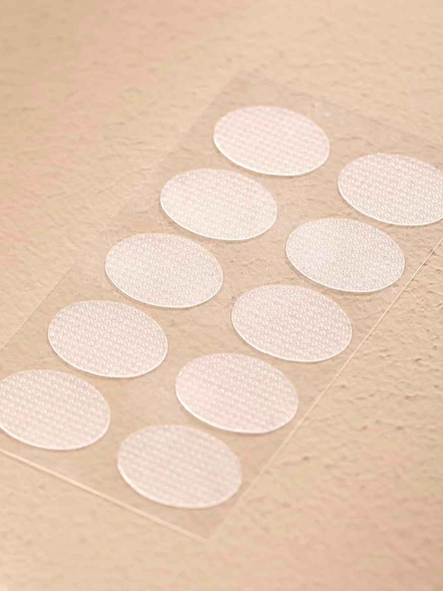 Earlobe support patch for pierced ears that eliminates the look of torn or stretched piercings and protects earlobes from tearing